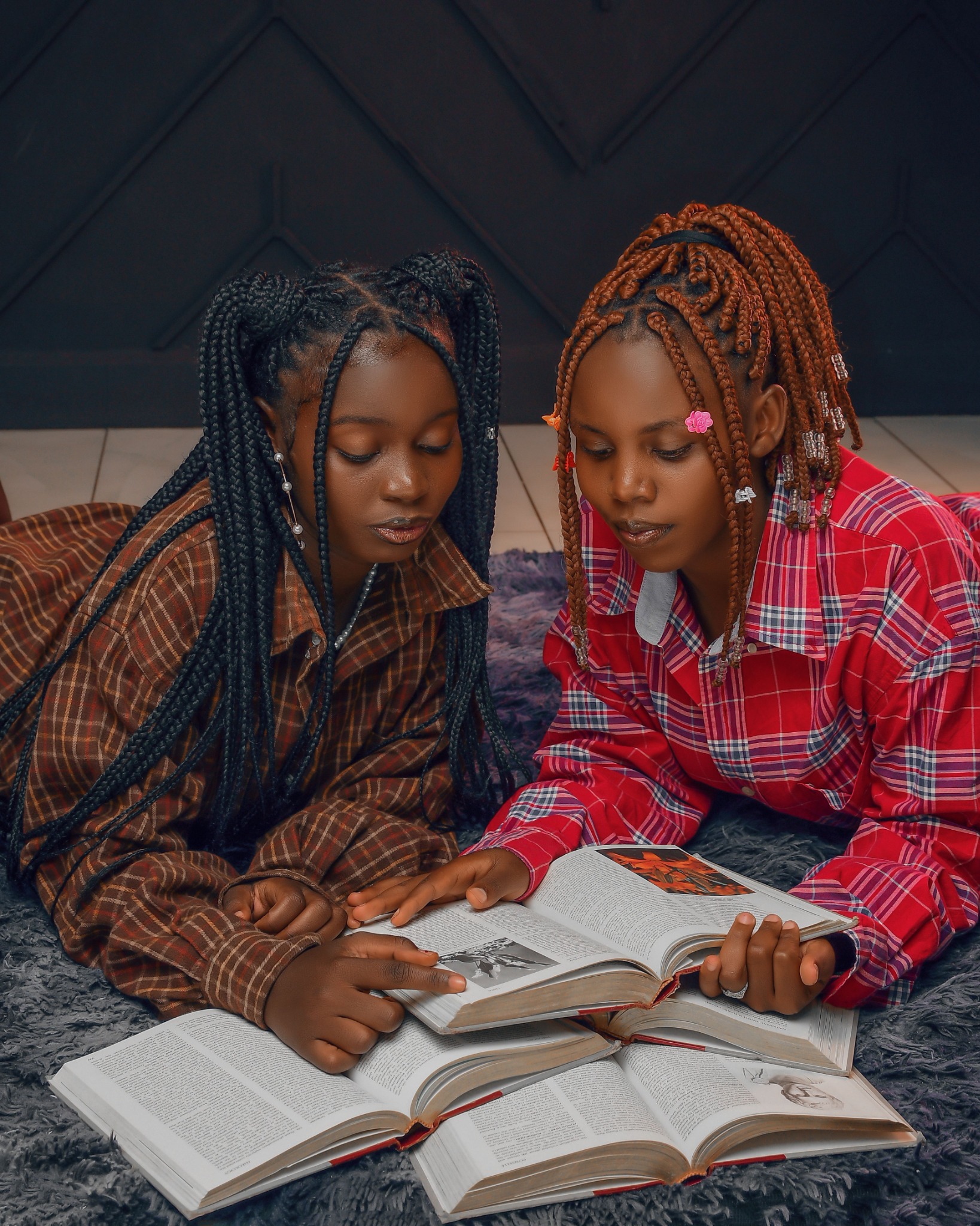 Young readers sharing books